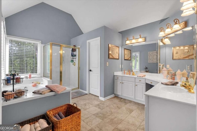 full bathroom featuring a stall shower, lofted ceiling, vanity, and a bath