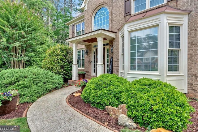 property entrance with brick siding