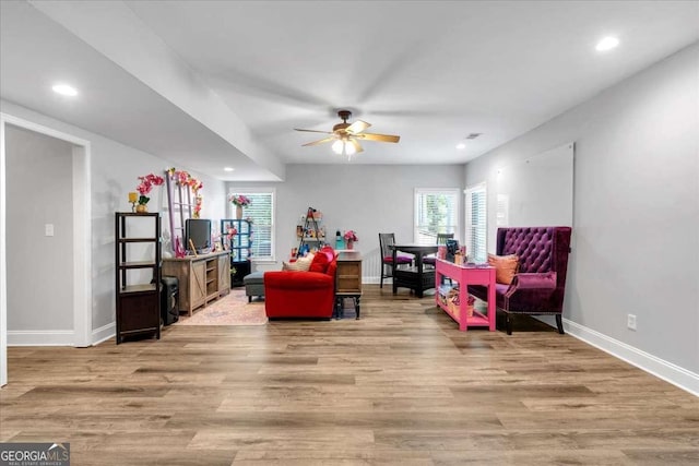 recreation room with ceiling fan, baseboards, light wood-style flooring, and recessed lighting