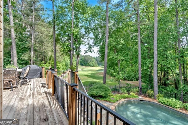 deck featuring outdoor dining space and fence