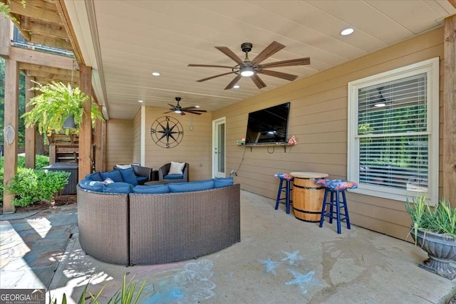 view of patio featuring outdoor lounge area and a ceiling fan
