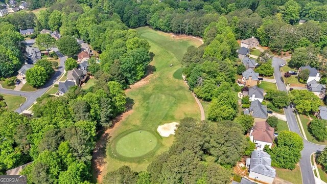 aerial view of property's location featuring nearby suburban area and a golf club