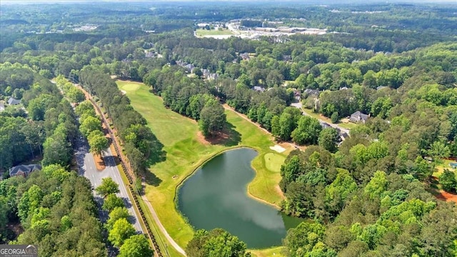 aerial overview of property's location featuring a large body of water and a heavily wooded area
