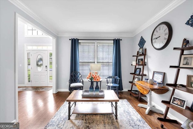 foyer featuring dark wood-style flooring, ornamental molding, and baseboards