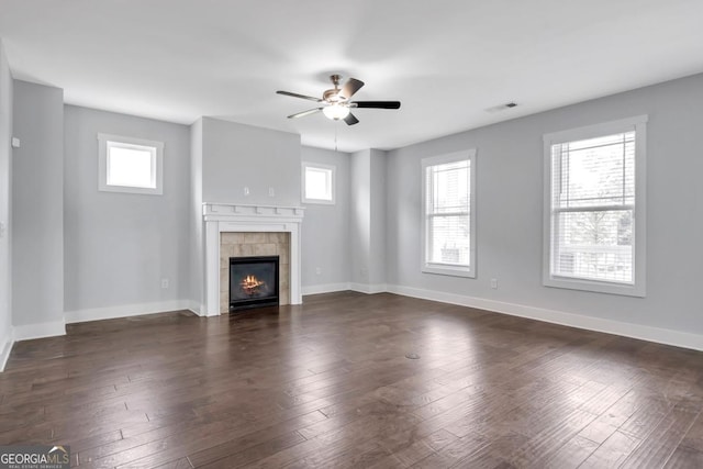 2342 Terrace View Cir SW, Atlanta, GA 30315 - unfurnished living room with a tile fireplace, ceiling fan, baseboards, and dark wood-style flooring
