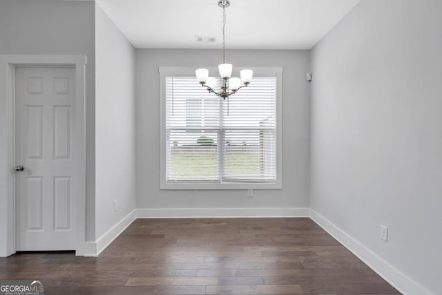 2342 Terrace View Cir SW, Atlanta, GA 30315 - unfurnished dining area featuring a chandelier, baseboards, and dark wood-style flooring