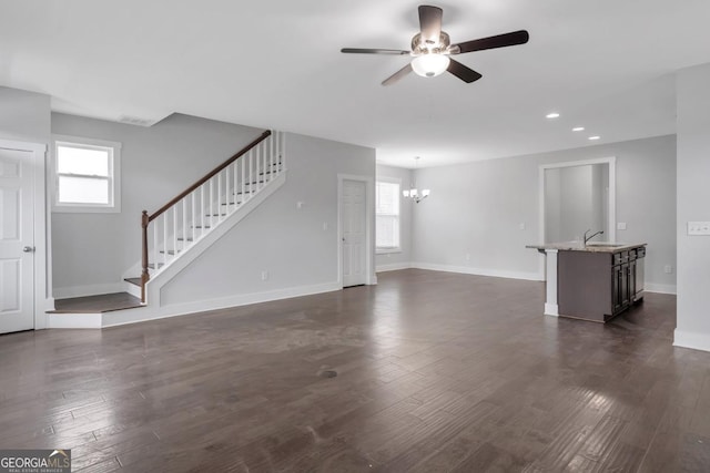 2342 Terrace View Cir SW, Atlanta, GA 30315 - unfurnished living room featuring ceiling fan, stairs, dark wood-type flooring, recessed lighting, and baseboards