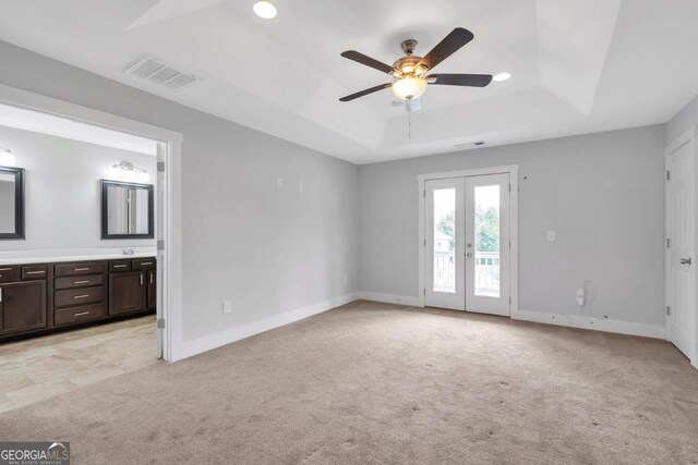 2342 Terrace View Cir SW, Atlanta, GA 30315 - unfurnished bedroom featuring access to exterior, a raised ceiling, light colored carpet, and french doors
