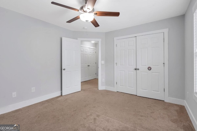 2342 Terrace View Cir SW, Atlanta, GA 30315 - unfurnished bedroom with carpet flooring, baseboards, a closet, and a ceiling fan