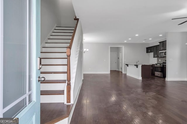 2342 Terrace View Cir SW, Atlanta, GA 30315 - unfurnished living room featuring recessed lighting, a ceiling fan, stairs, baseboards, and dark wood-style floors