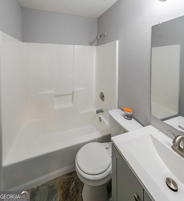 180 Old Airport Rd, Carrollton, GA 30116 - bathroom with toilet, tub / shower combination, vanity, and a textured ceiling