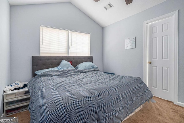 bedroom featuring carpet flooring, lofted ceiling, and a ceiling fan