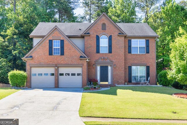 1500 Highland Farm Dr, Suwanee, GA 30024 - view of front of house featuring driveway, a garage, a front lawn, and brick siding