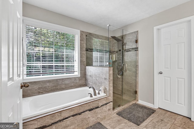 1500 Highland Farm Dr, Suwanee, GA 30024 - full bath with a stall shower, a garden tub, and baseboards