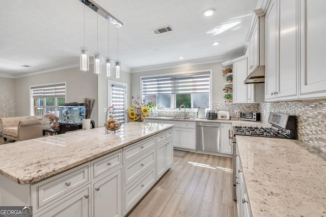 1500 Highland Farm Dr, Suwanee, GA 30024 - kitchen featuring appliances with stainless steel finishes, light wood-style floors, ornamental molding, decorative backsplash, and light stone counters