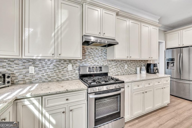 1500 Highland Farm Dr, Suwanee, GA 30024 - kitchen featuring appliances with stainless steel finishes, under cabinet range hood, backsplash, light wood finished floors, and ornamental molding