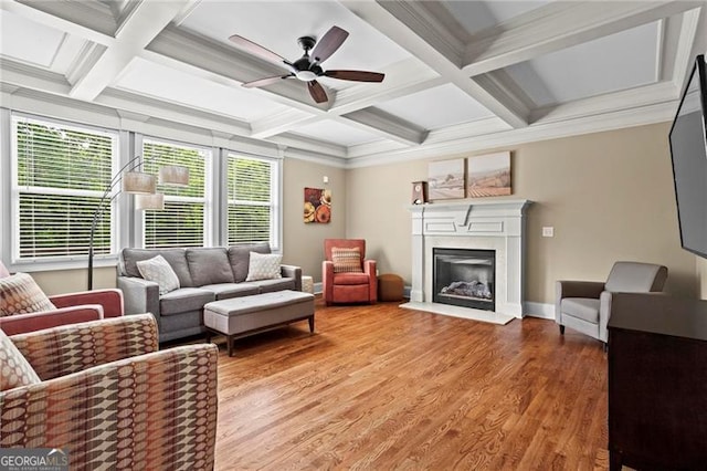 7493 Elderberry Dr, Douglasville, GA 30135 - living room featuring coffered ceiling, baseboards, a glass covered fireplace, ceiling fan, and light wood finished floors