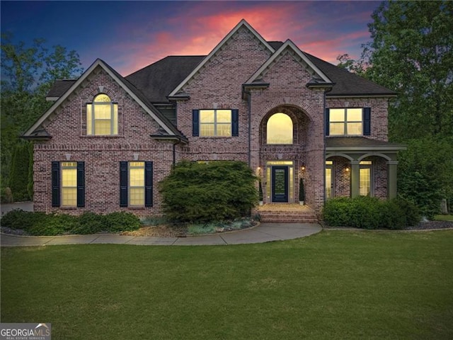 7493 Elderberry Dr, Douglasville, GA 30135 - traditional-style house featuring a front yard and brick siding
