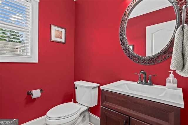 7493 Elderberry Dr, Douglasville, GA 30135 - half bath featuring baseboards, toilet, and vanity