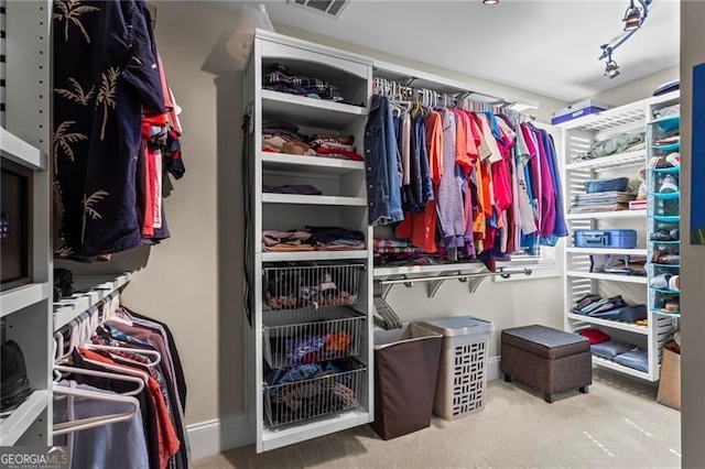 7493 Elderberry Dr, Douglasville, GA 30135 - walk in closet featuring carpet flooring