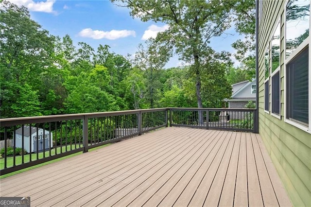 7493 Elderberry Dr, Douglasville, GA 30135 - wooden deck with a shed and an outbuilding