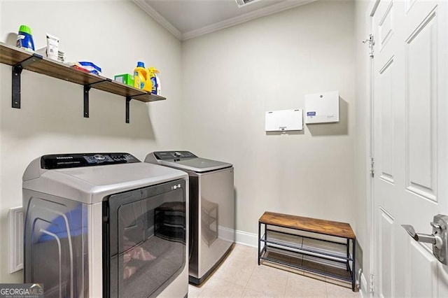 1399 Kilchis Falls Way, Braselton, GA 30517 - washroom featuring ornamental molding, washer and clothes dryer, baseboards, and light tile patterned floors