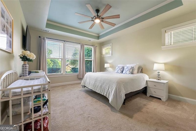 1399 Kilchis Falls Way, Braselton, GA 30517 - carpeted bedroom with a tray ceiling, ornamental molding, baseboards, and a ceiling fan