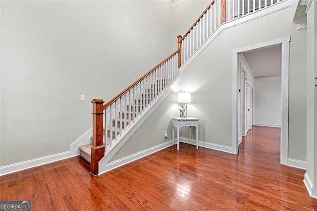 1399 Kilchis Falls Way, Braselton, GA 30517 - stairs with wood finished floors and baseboards