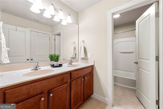 1399 Kilchis Falls Way, Braselton, GA 30517 - full bathroom featuring double vanity, tile patterned floors, baseboards, and shower / bath combination