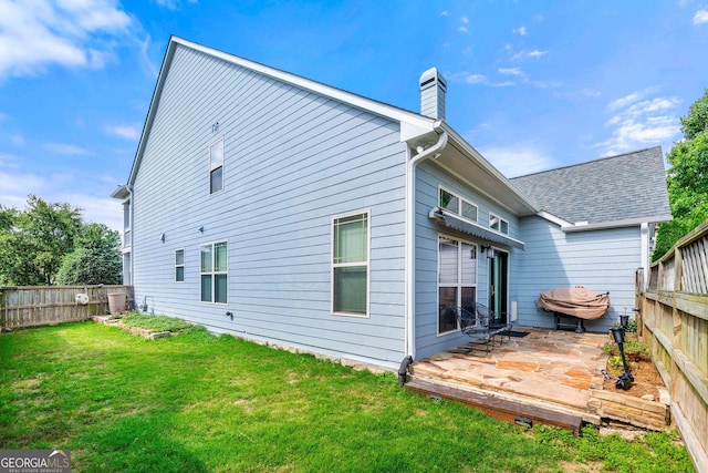 1399 Kilchis Falls Way, Braselton, GA 30517 - rear view of house featuring a wooden deck and a chimney