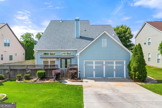 1399 Kilchis Falls Way, Braselton, GA 30517 - rear view of house with roof with shingles, concrete driveway, a garage, and a chimney