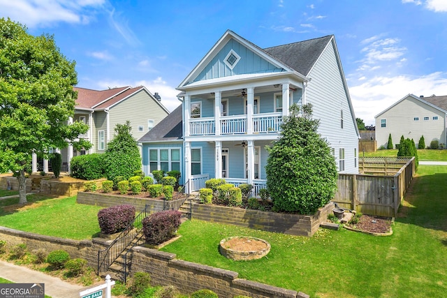 1399 Kilchis Falls Way, Braselton, GA 30517 - view of front of home with a ceiling fan, board and batten siding, a porch, a balcony, and a shingled roof