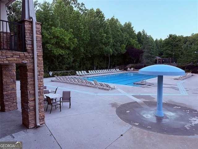 1399 Kilchis Falls Way, Braselton, GA 30517 - community pool with a patio