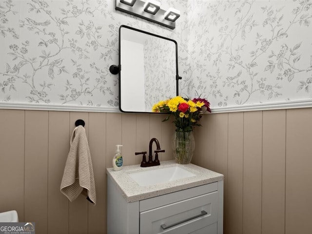 2458 Zachary Woods Dr, Marietta, GA 30064 - bathroom with wallpapered walls, a decorative wall, vanity, and a wainscoted wall