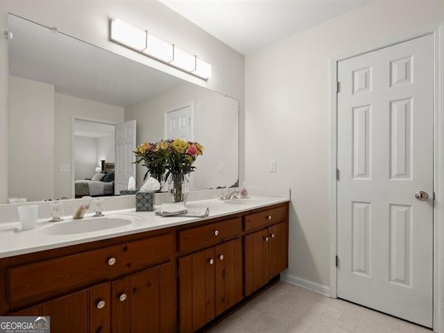 2458 Zachary Woods Dr, Marietta, GA 30064 - full bath with ensuite bathroom, double vanity, and baseboards