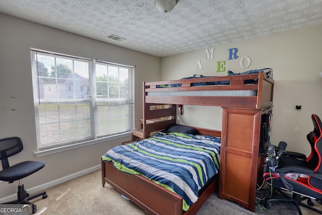 2000 Redwood Trce, Ellenwood, GA 30294 - bedroom featuring light colored carpet and a textured ceiling