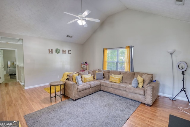2000 Redwood Trce, Ellenwood, GA 30294 - living area with ceiling fan, attic access, light wood finished floors, and high vaulted ceiling