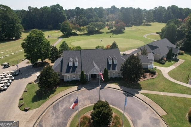aerial view of property's location featuring a local golf course