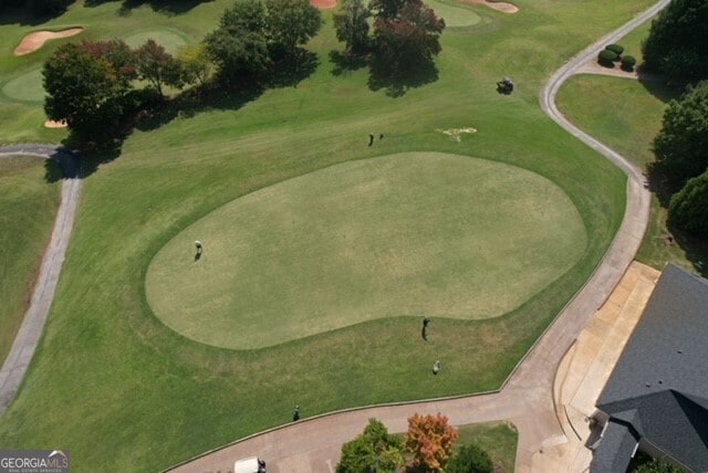 aerial overview of property's location featuring a golf course