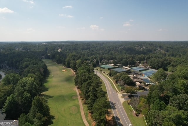 aerial view of property's location with a heavily wooded area