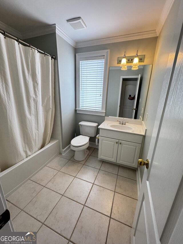 full bathroom with crown molding, toilet, vanity, baseboards, and tile patterned floors
