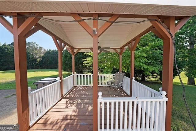 wooden deck with a lawn