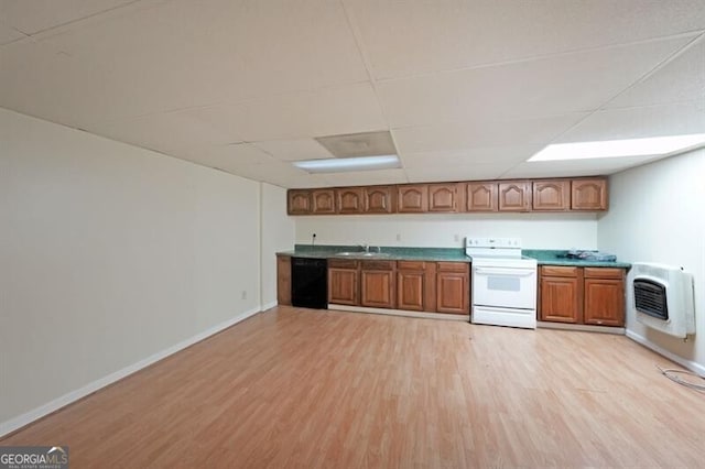 kitchen with white electric range oven, dishwasher, heating unit, a sink, and light wood-style floors