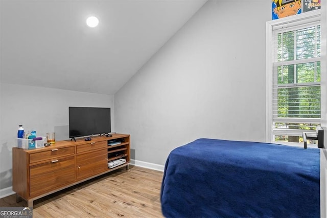 1174 Princess Ave SW, Atlanta, GA 30310 - bedroom with lofted ceiling, light wood finished floors, and baseboards