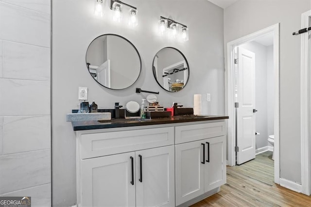 1174 Princess Ave SW, Atlanta, GA 30310 - full bath with vanity, wood finished floors, toilet, and baseboards