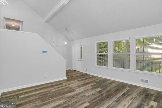 unfurnished living room featuring lofted ceiling, wood finished floors, and baseboards