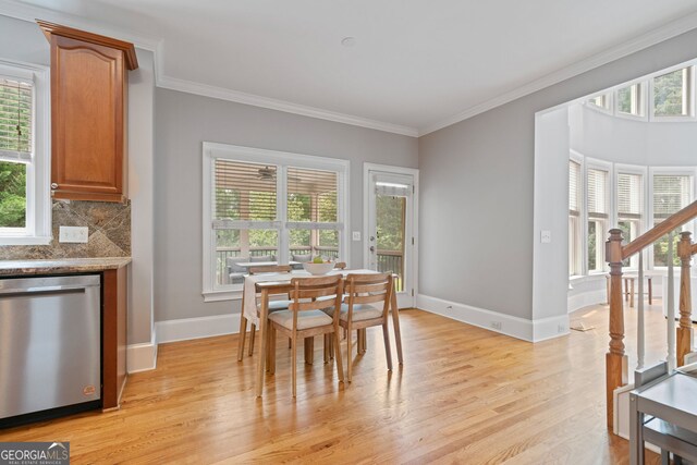 100 Braxton Way, Roswell, GA 30075 - dining area featuring light wood-style flooring, crown molding, baseboards, and stairway