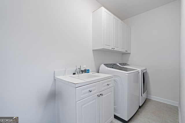 100 Braxton Way, Roswell, GA 30075 - laundry area with cabinet space, washing machine and dryer, baseboards, and light tile patterned floors