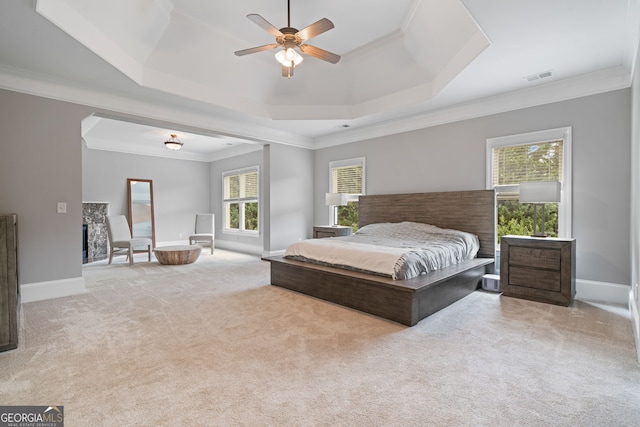 100 Braxton Way, Roswell, GA 30075 - carpeted bedroom with a tray ceiling, ornamental molding, baseboards, ceiling fan, and a premium fireplace
