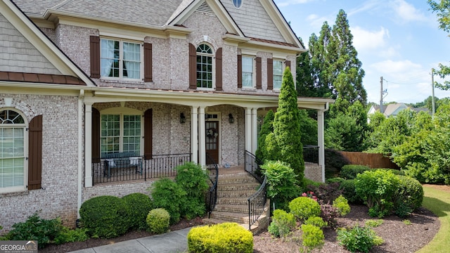 100 Braxton Way, Roswell, GA 30075 - craftsman-style home with brick siding, covered porch, and roof with shingles